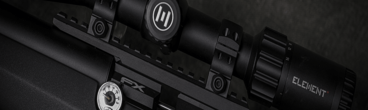 FX air rifle with a riflescope, side view