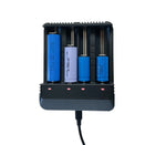 Four-slot battery charger with USB cable connected
